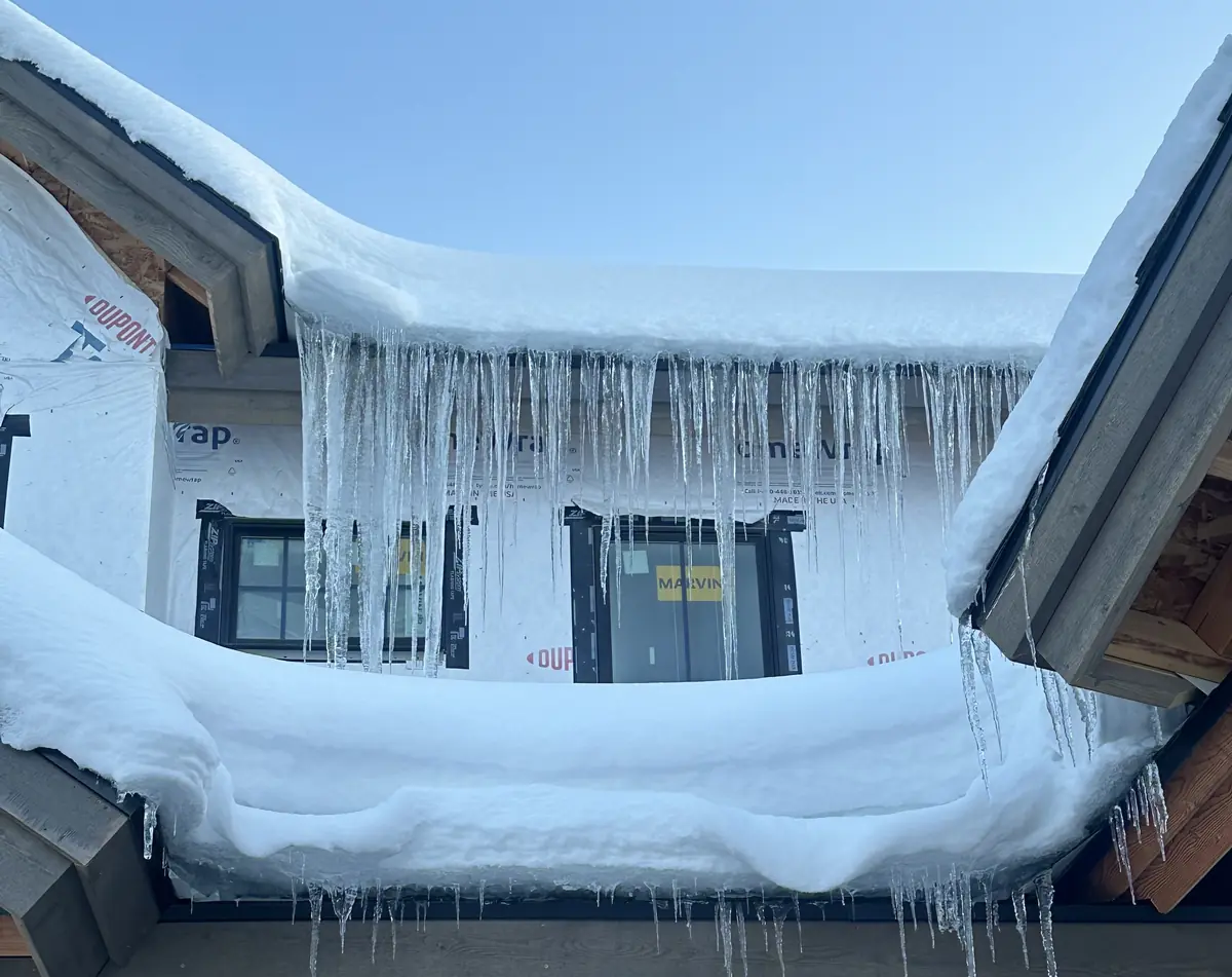 Ice dams and icicles on roof eaves Boise Idaho winter
